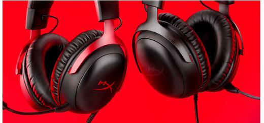 Two red and black headphones resting on a vibrant red background, showcasing a stylish and modern design.